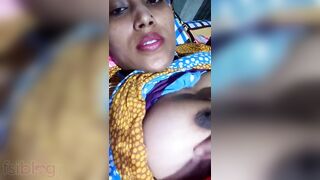 Pretty Desi MILF poses for the camera and teases with big XXX tits