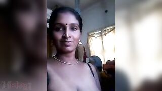 Desi with saggy boobs takes XXX pose on cam and masturbates with toy