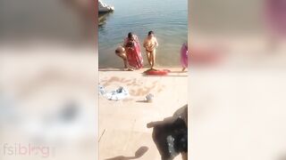 Shameless Desi bhabhi poses topless on the river bank in XXX video