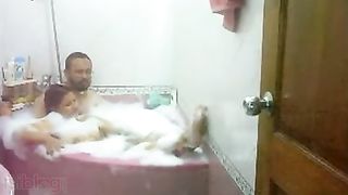 Aged couple have a fun a romantic baths in their bathtub